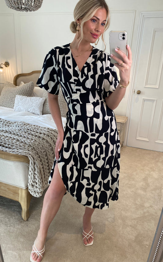 Abstract print wrap dress in black and white