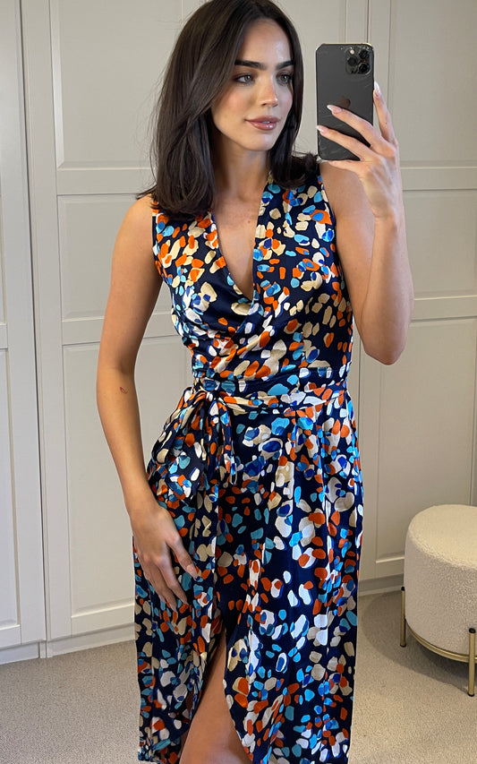 Sleeveless wrap dress in multicolour polka dot print