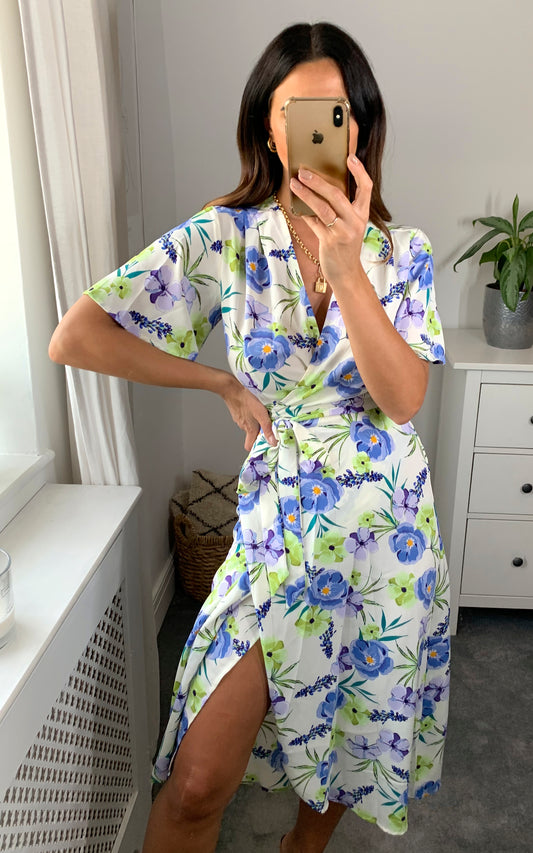 White floral print wrap dress with short sleeves and belt fastening