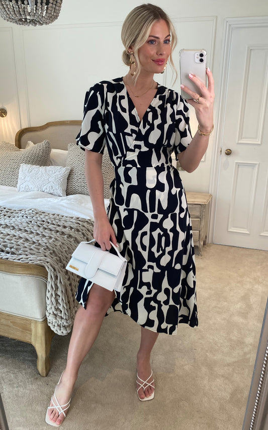 Abstract print wrap dress in black and white