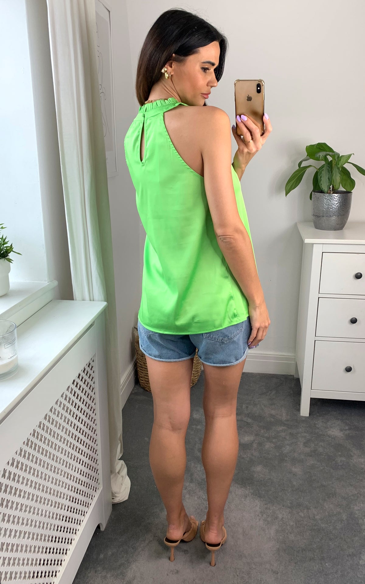 Sleeveless halter high neck top in neon green