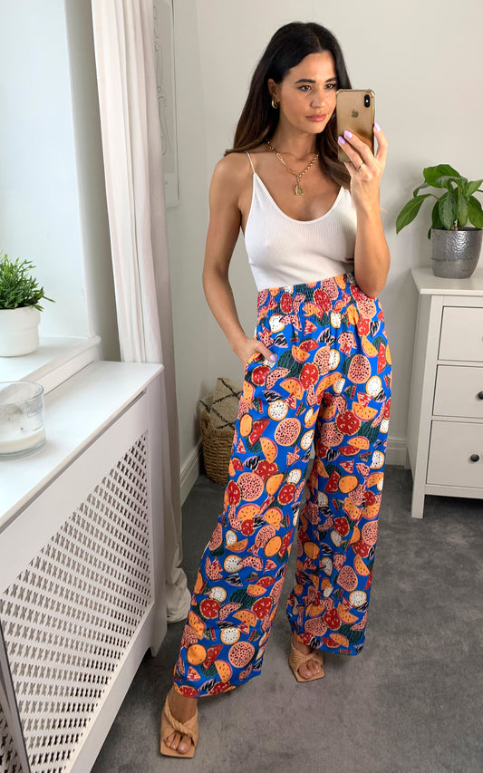 Multicolour printed wide leg trousers with elasticated waist band and pockets